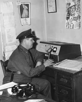 Sheriff Roger Powell at a dispatch radio
